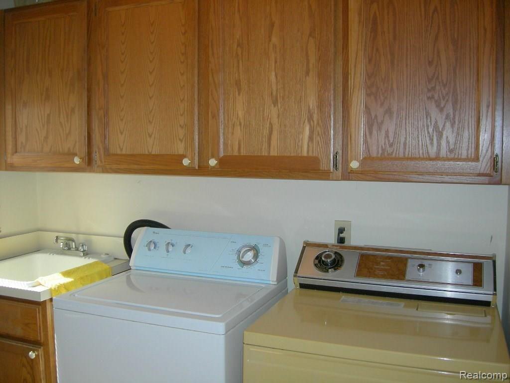 18349 Gill Road Livonia, MI 48152 - Photo 15 of 27 1st floor laundry with ample storage and closet