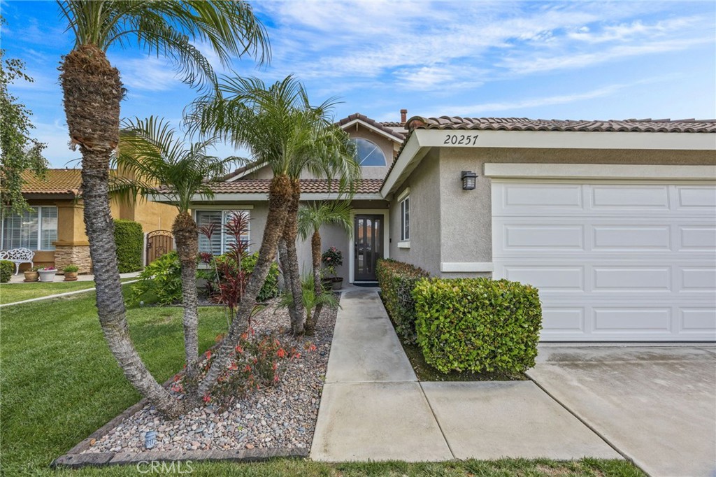 20257 Edmund Road Riverside, CA 92508 - Photo 4 of 53 a front view of a house with garden