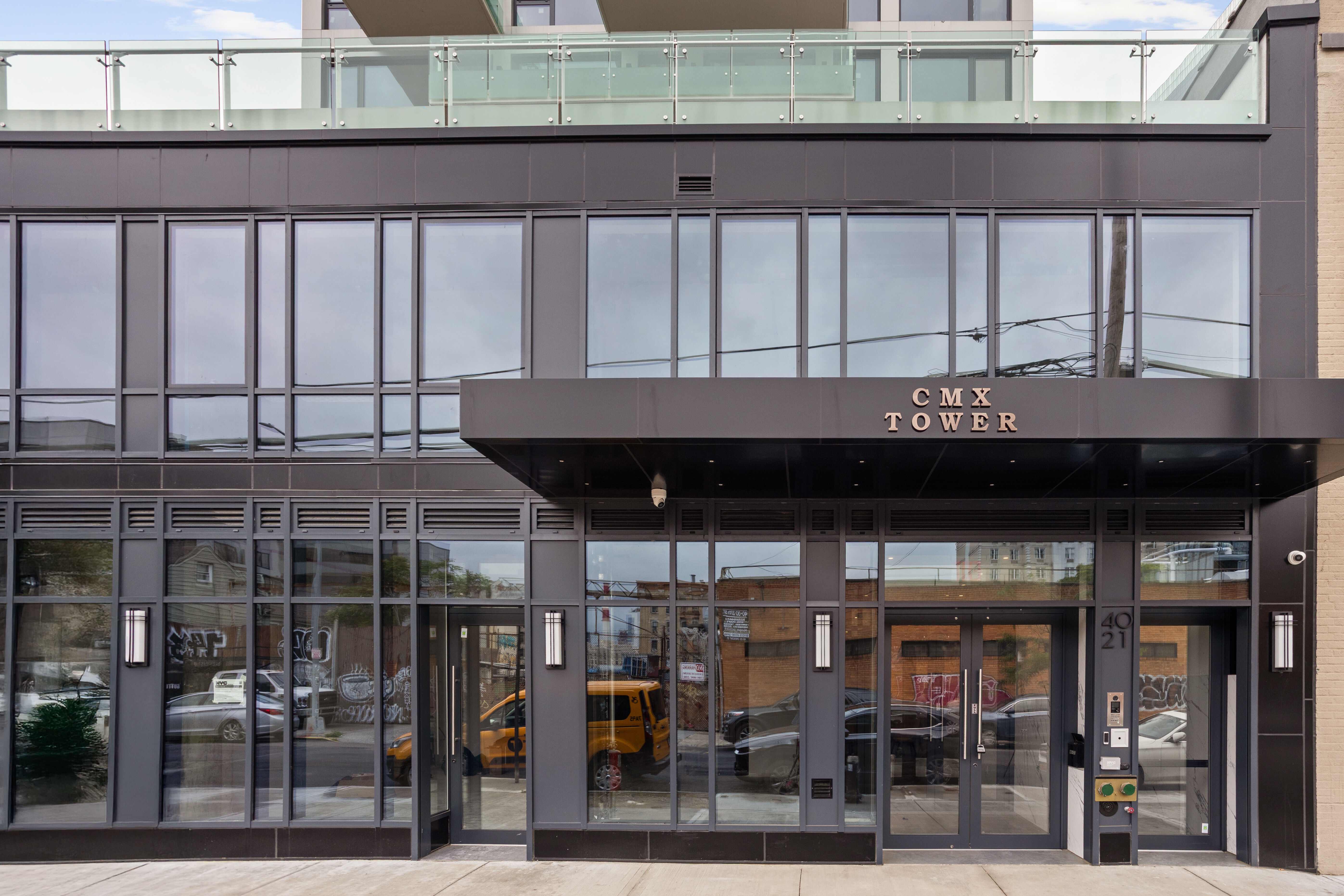 40-21 27th Street, Unit 6C Queens, NY 11101 - Photo 3 of 4 a front view of a building with glass windows