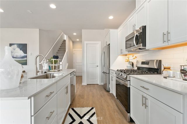 a bedroom with a bed and a cabinet