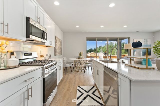 a view of a hallway with washer and dryer