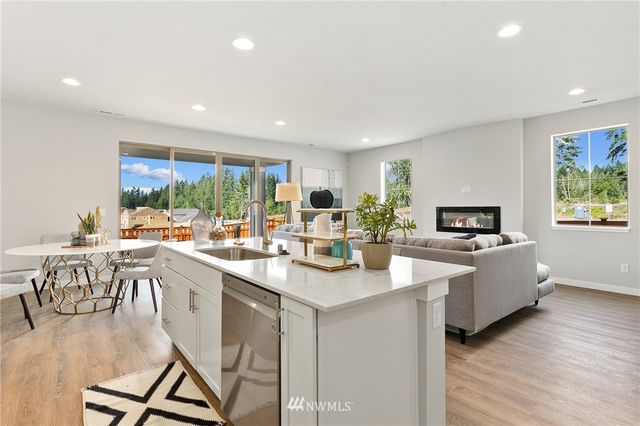 a bedroom with a bed and a chair in it