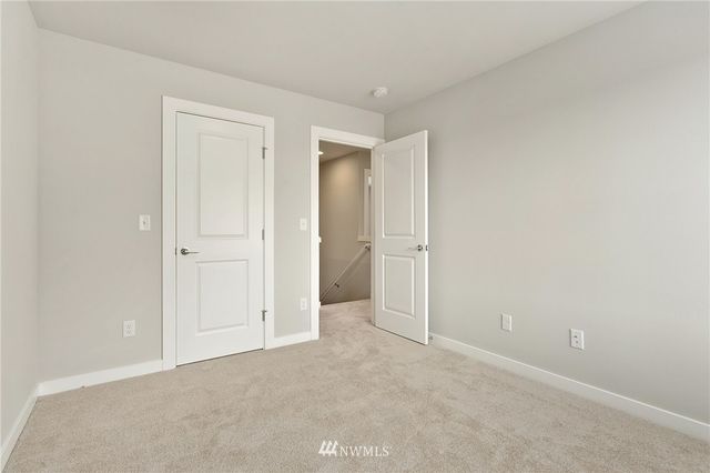 a bathroom with sink shower and mirror