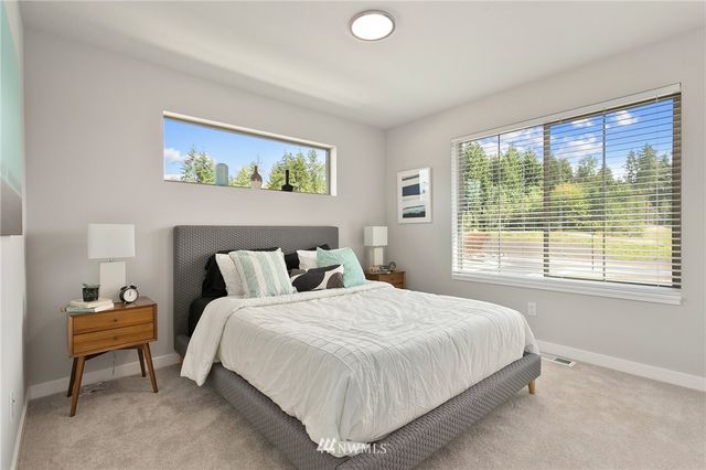 a building outdoor space with patio furniture and potted plants
