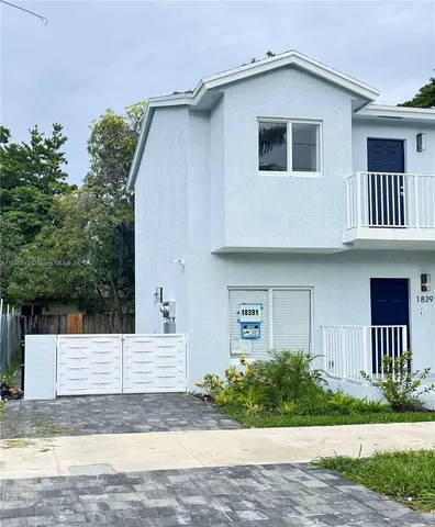 a house view with a garden space