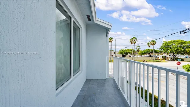 a view of a street with cars