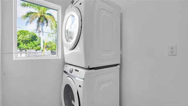 a white toilet sitting next to a shower