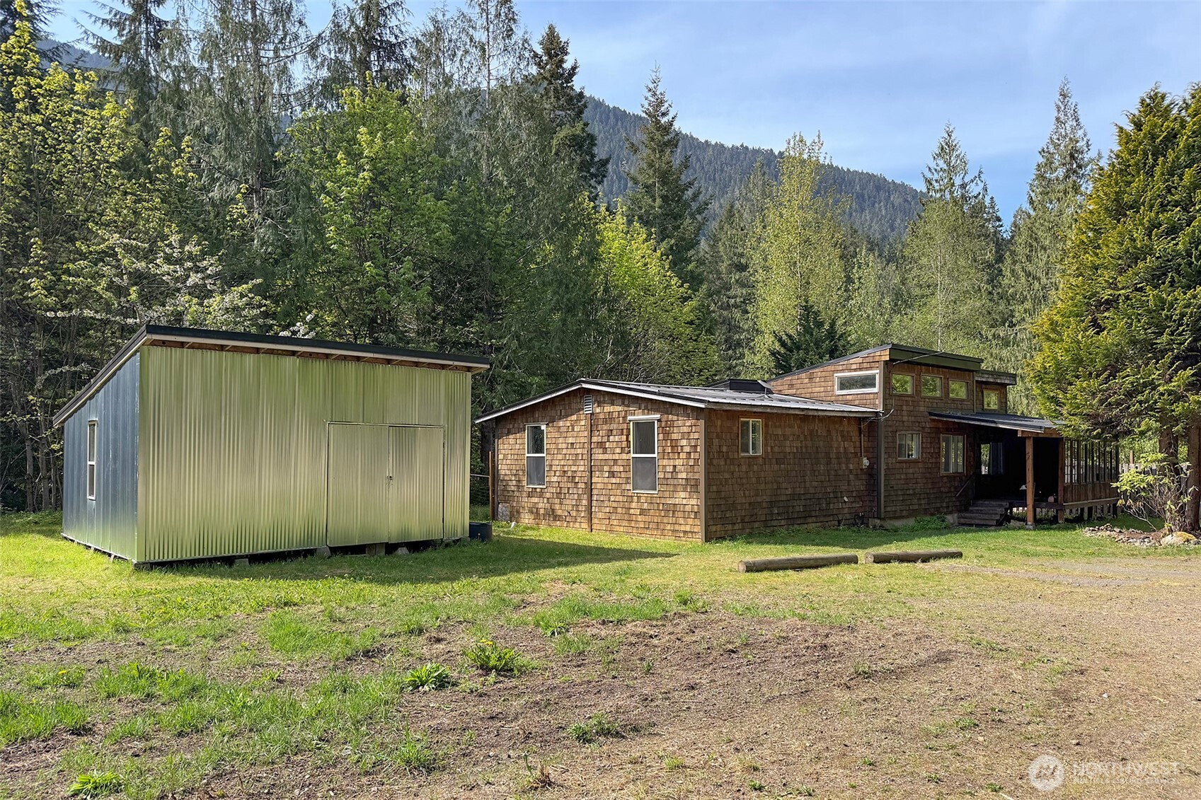 834 Little River Road Port Angeles, WA 98363 - Photo 3 of 40 a front view of a house with a yard