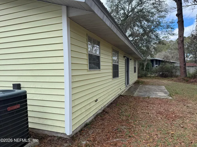 a view of a back yard of the house