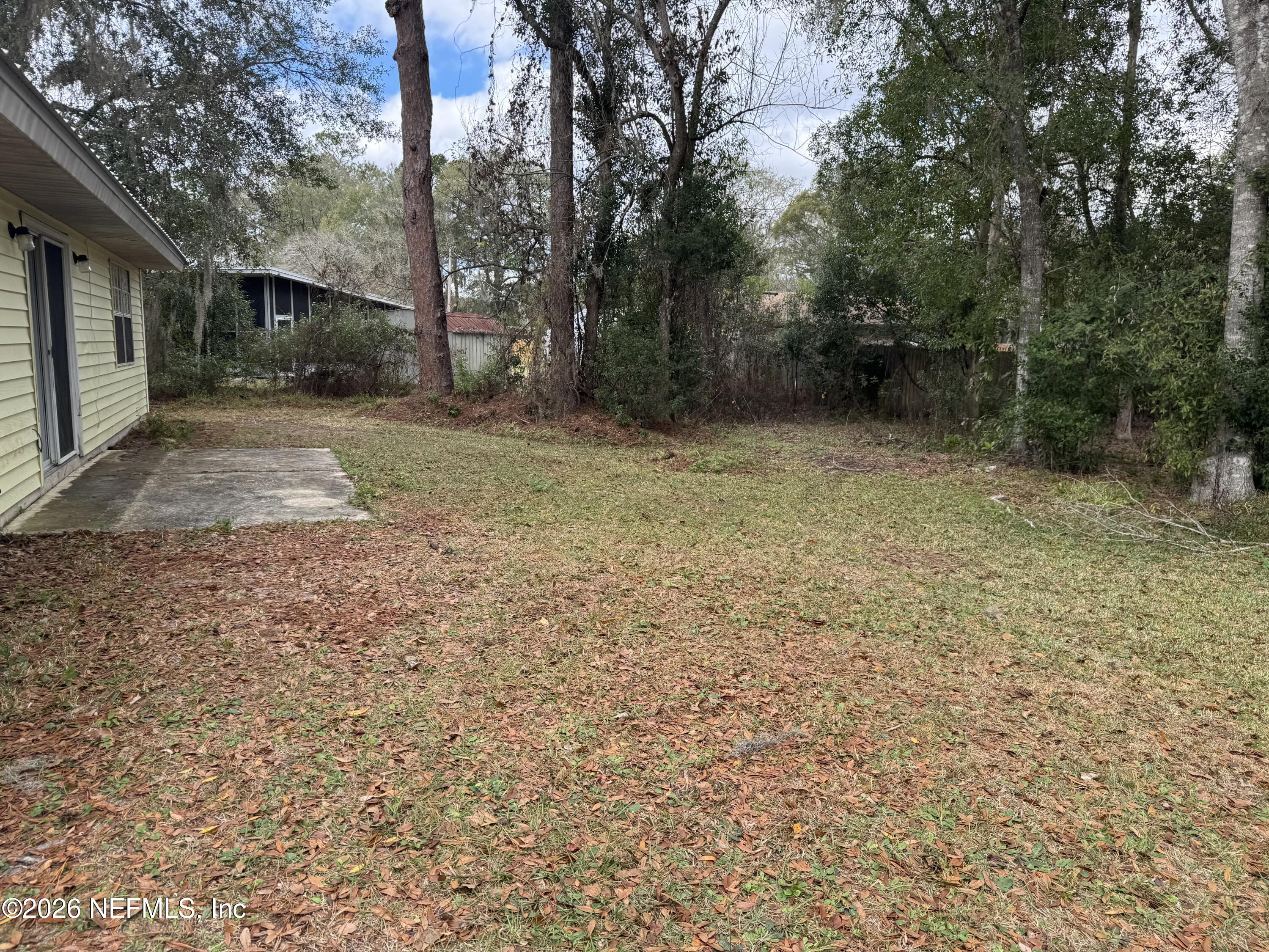 1015 West Pratt Street Starke, FL 32091 - Photo 3 of 14 a view of a yard with trees
