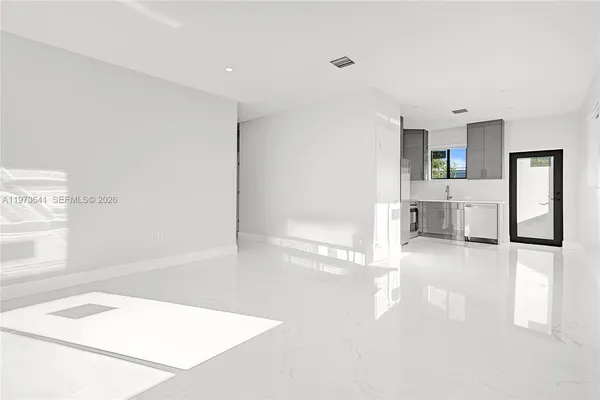 a view of a hallway with staircase