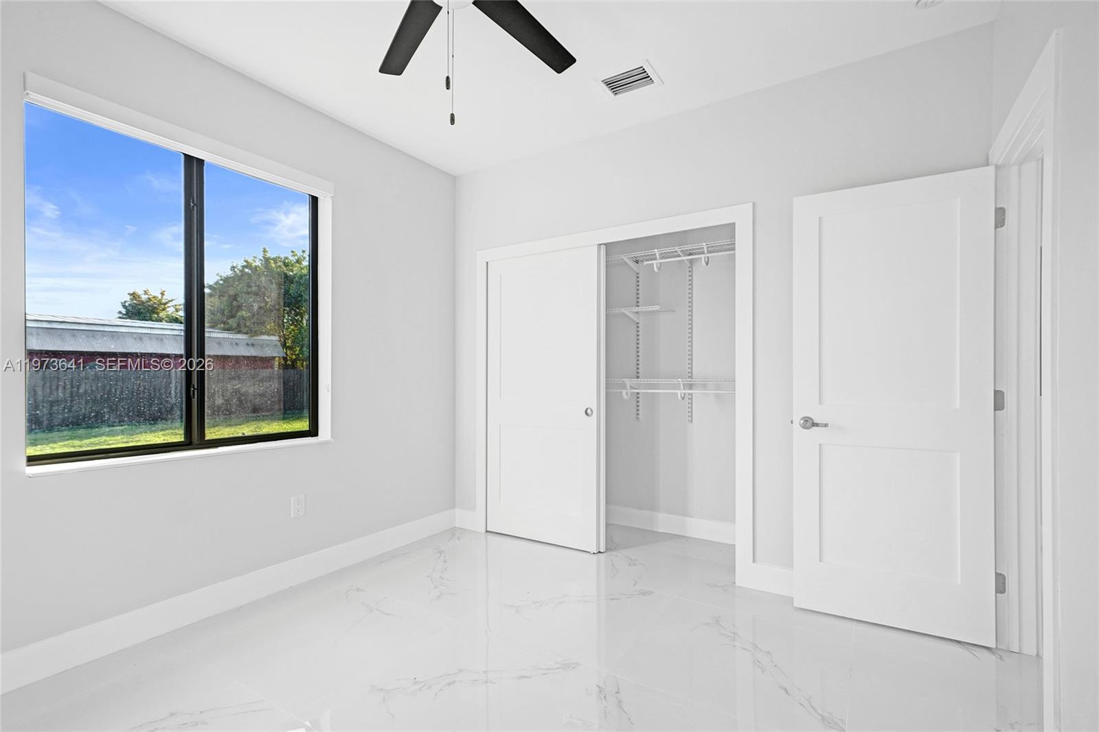 12120 Southwest 219th Street, Unit B Miami, FL 33170 - Photo 24 of 53 a view of an empty room with a window