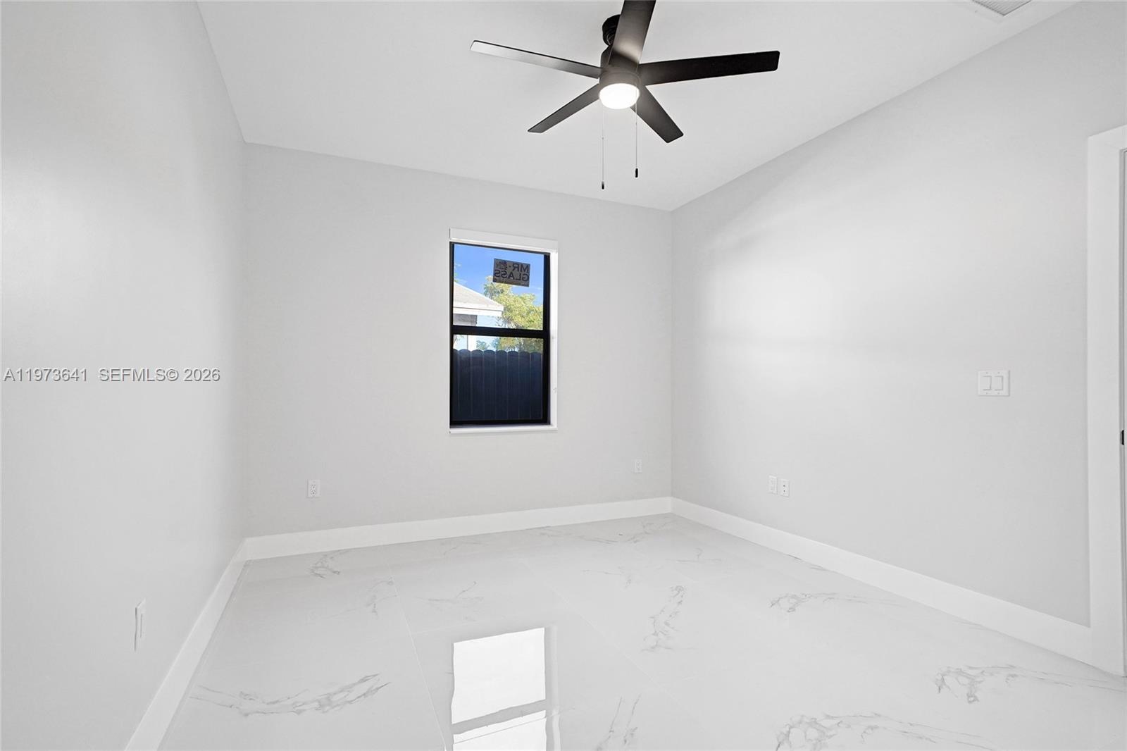 12120 Southwest 219th Street, Unit B Miami, FL 33170 - Photo 28 of 53 an empty room with a window and a fan