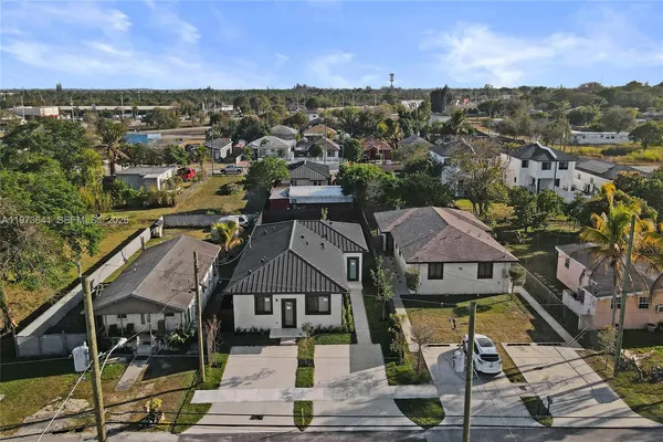an aerial view of house with yard