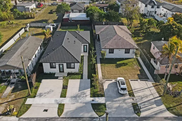 an aerial view of a house with a garden