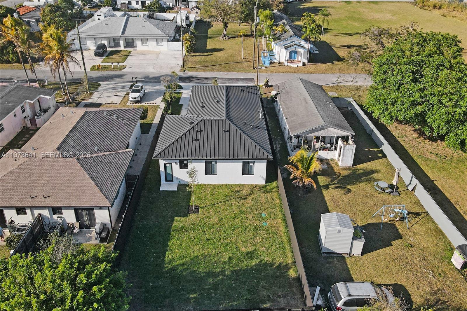 12120 Southwest 219th Street, Unit B Miami, FL 33170 - Photo 39 of 53 an aerial view of residential houses with outdoor space