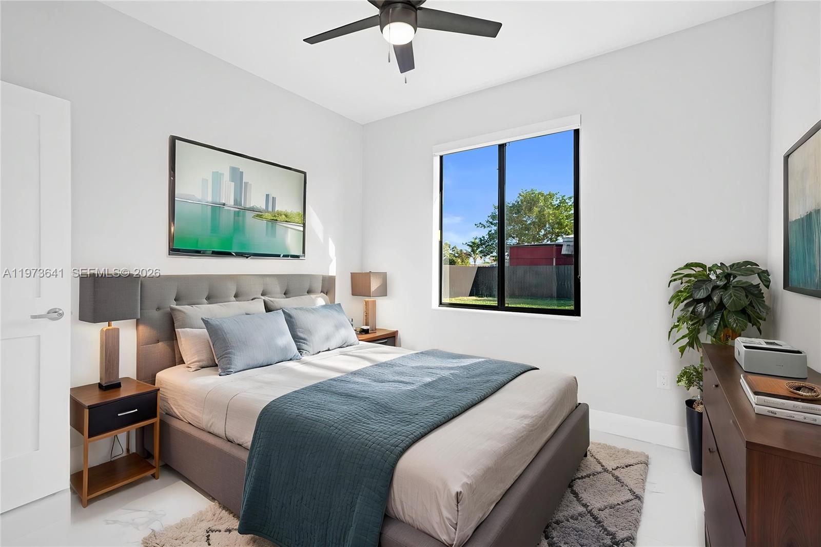 12120 Southwest 219th Street, Unit B Miami, FL 33170 - Photo 6 of 53 a bedroom with a bed and a potted plant