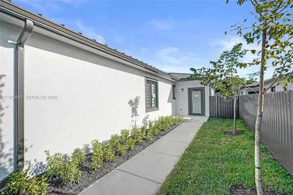 a view of a living room hardwood floor and a window