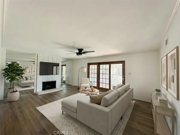 a living room with furniture fireplace and a flat screen tv