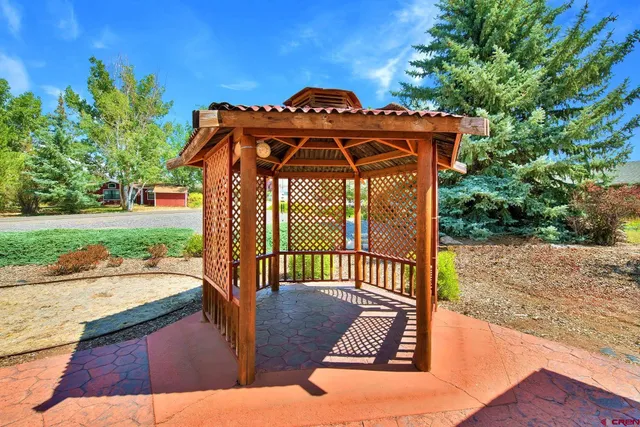 a view of a pathway of a house with a patio