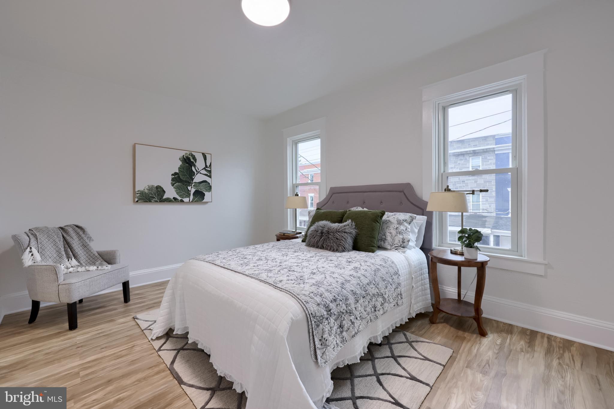 610 East Madison Street Lancaster, PA 17602 - Photo 17 of 68 a bedroom with a bed a rug and a window
