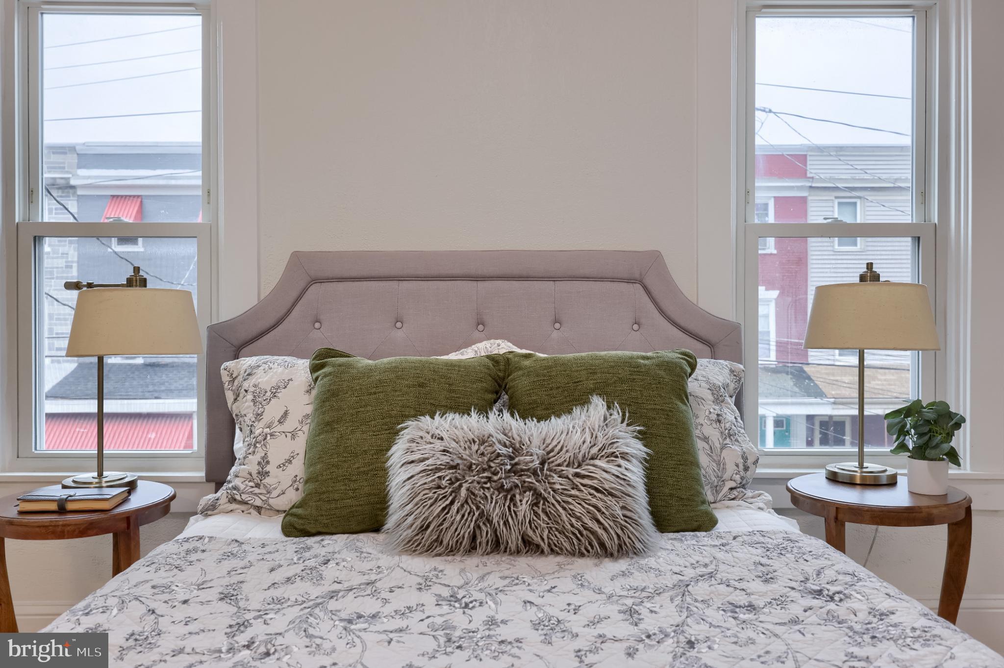 610 East Madison Street Lancaster, PA 17602 - Photo 19 of 68 a bed sitting in a bedroom next to a window