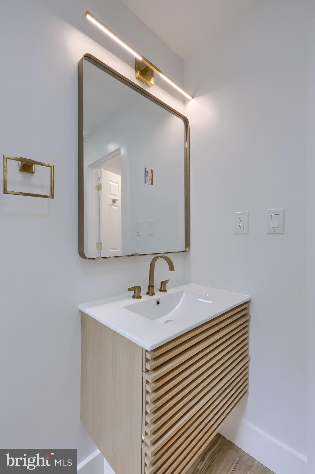 610 East Madison Street Lancaster, PA 17602 - Photo 22 of 68 a bathroom with a sink a mirror and a vanity