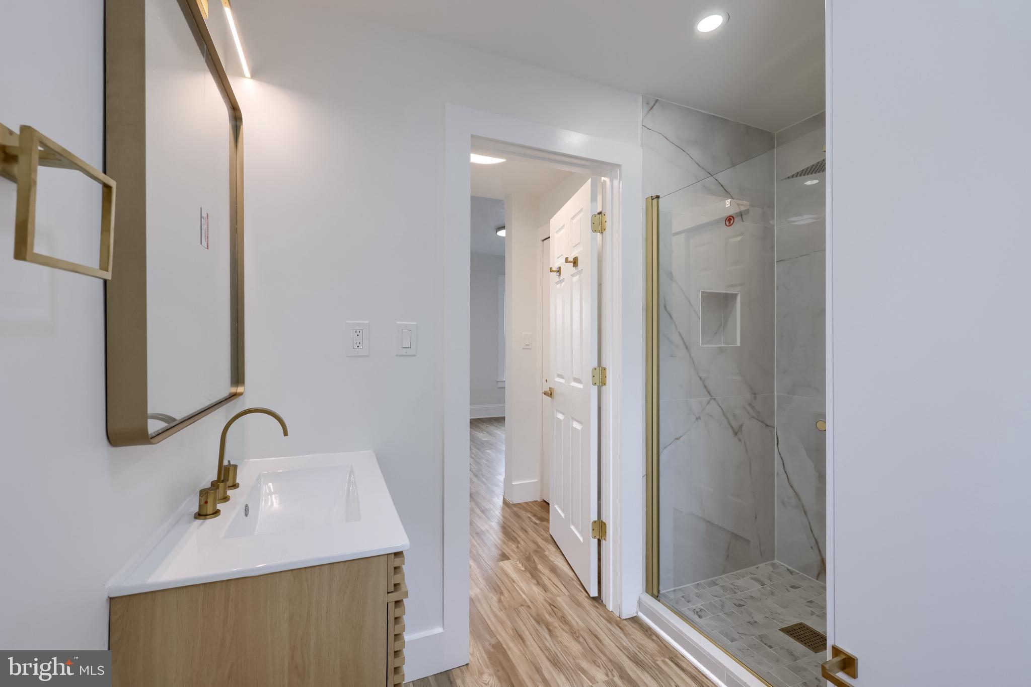 610 East Madison Street Lancaster, PA 17602 - Photo 23 of 68 a bathroom with a sink and a mirror