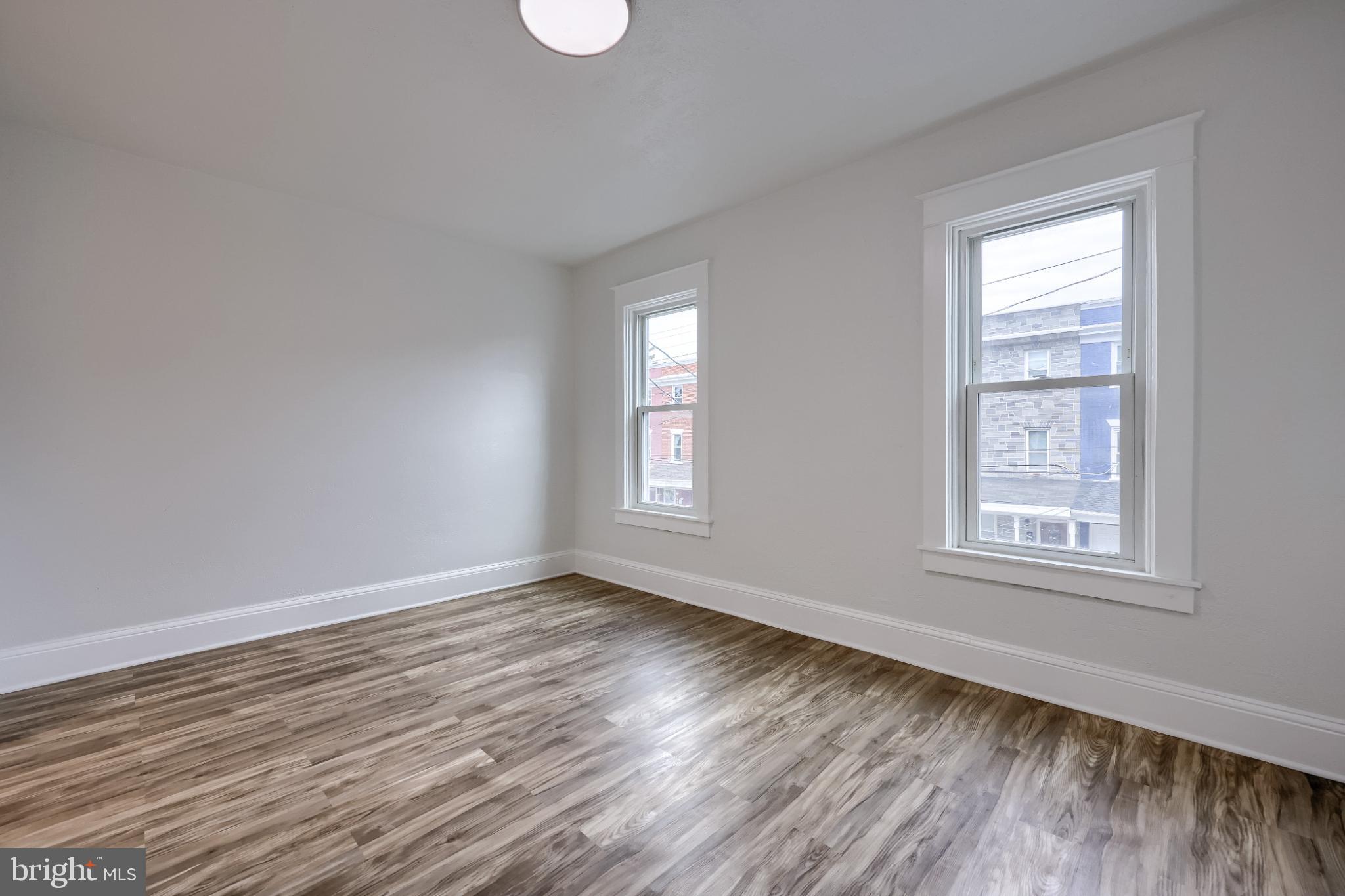 610 East Madison Street Lancaster, PA 17602 - Photo 28 of 68 a view of an empty room with wooden floor and window