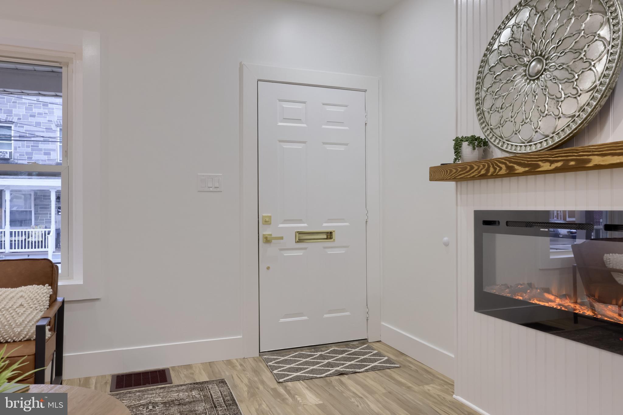 610 East Madison Street Lancaster, PA 17602 - Photo 3 of 68 a view of an entryway with a fireplace