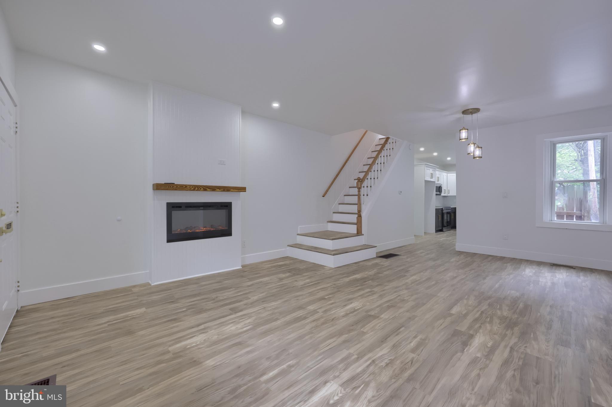 610 East Madison Street Lancaster, PA 17602 - Photo 50 of 68 an empty room with wooden floor and windows