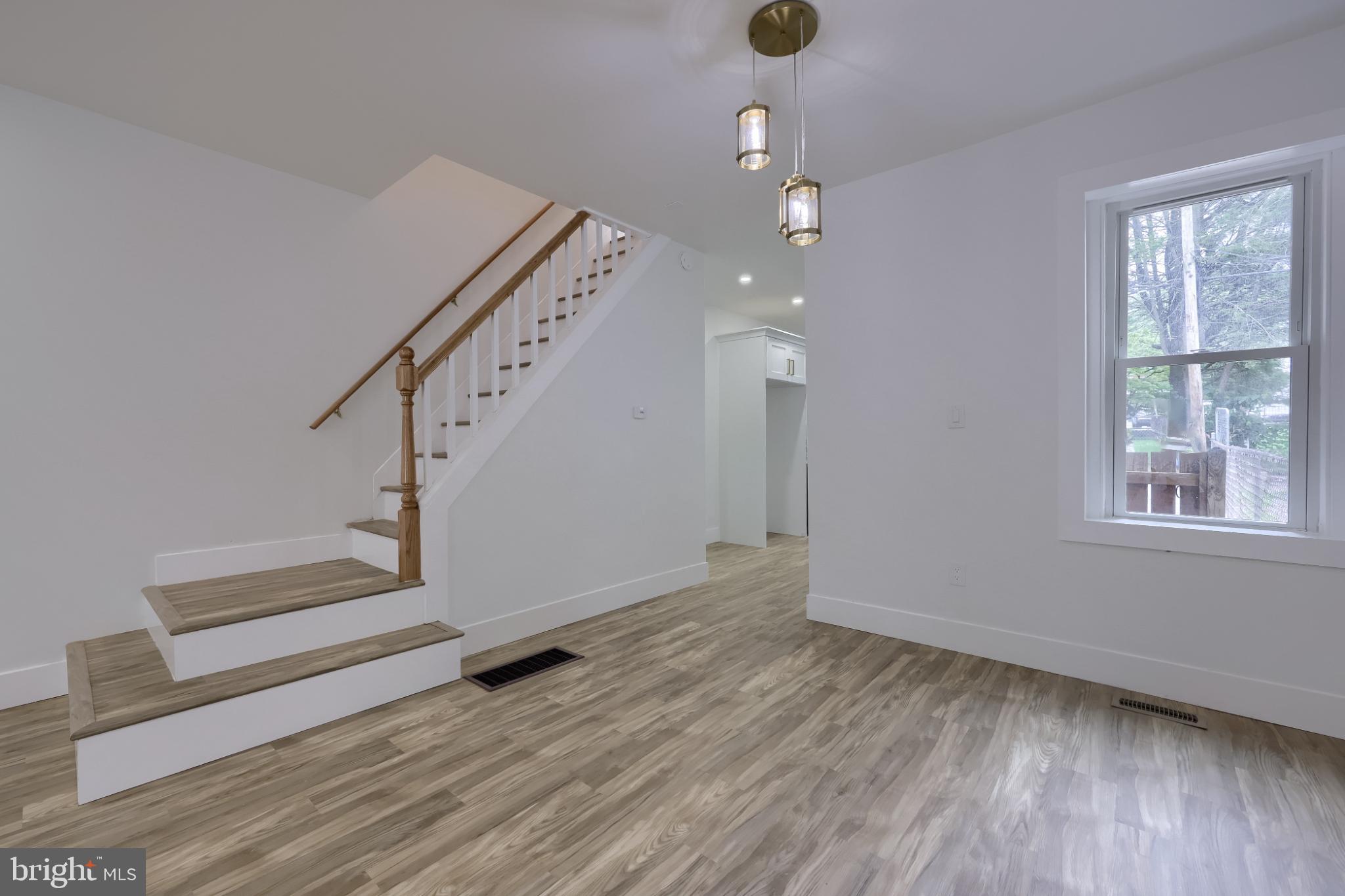 610 East Madison Street Lancaster, PA 17602 - Photo 54 of 68 wooden floor in an empty room with a window