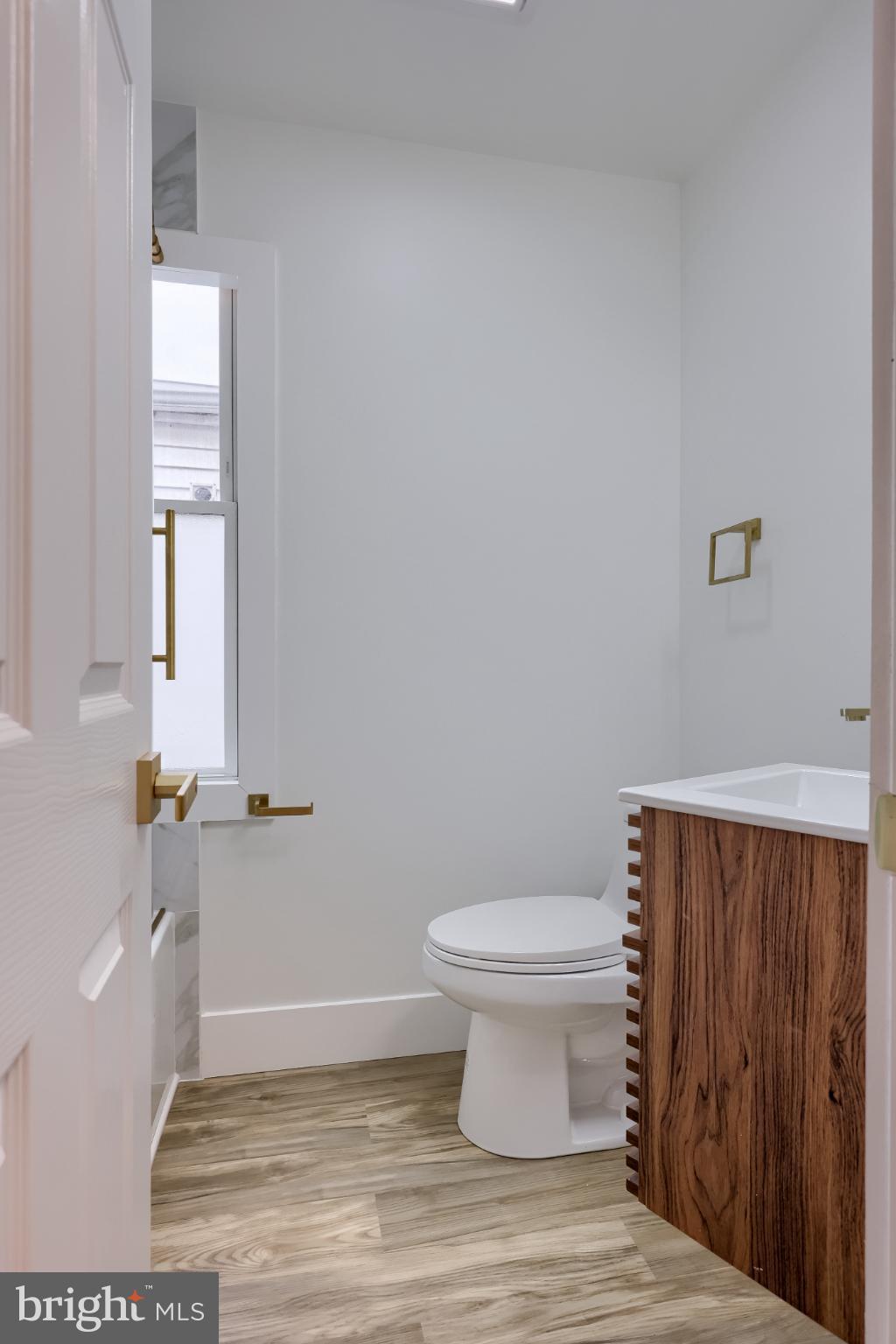 610 East Madison Street Lancaster, PA 17602 - Photo 56 of 68 a bathroom with a toilet and a window