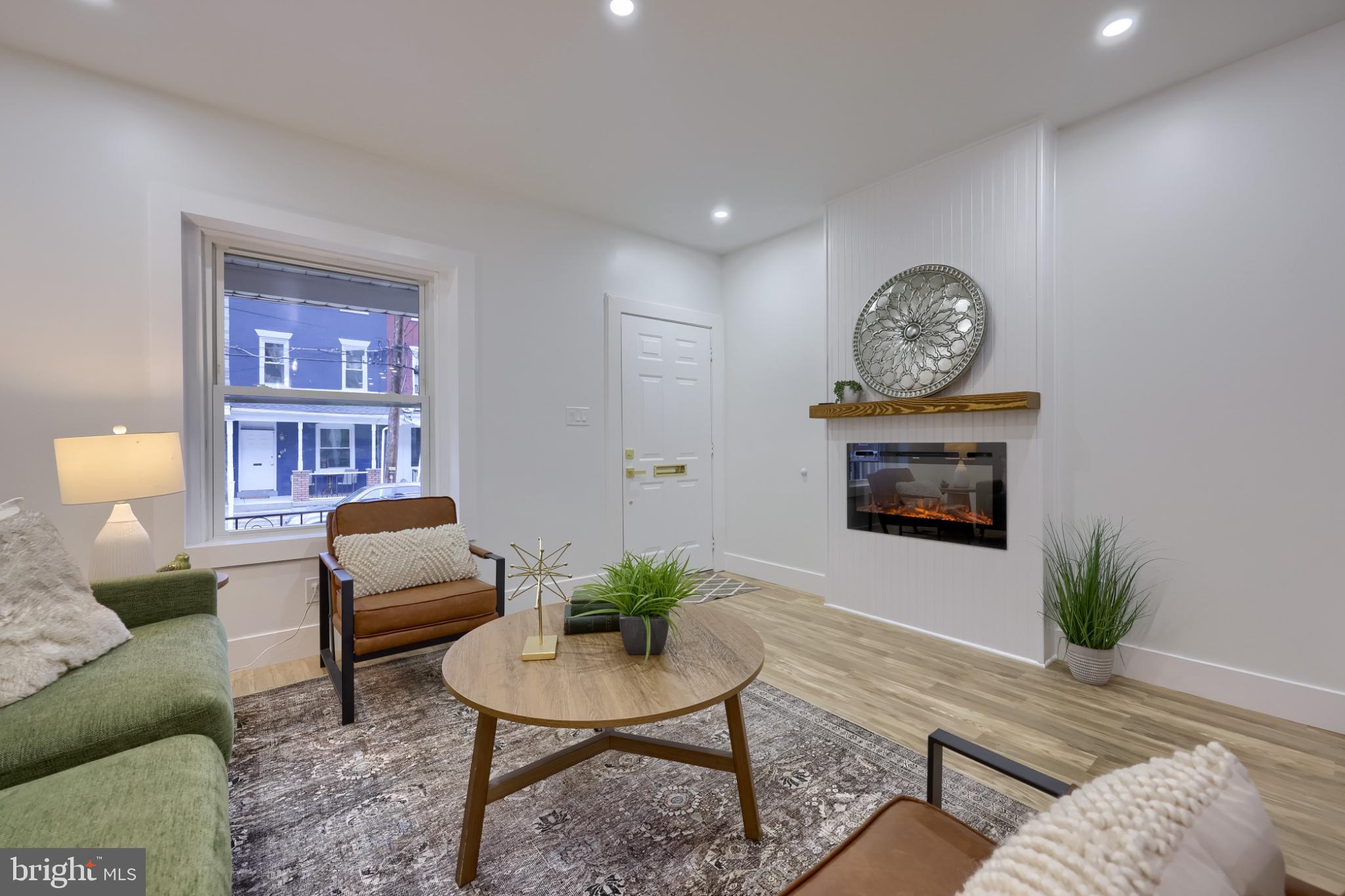 610 East Madison Street Lancaster, PA 17602 - Photo 6 of 68 a living room with furniture a rug and a wall painting