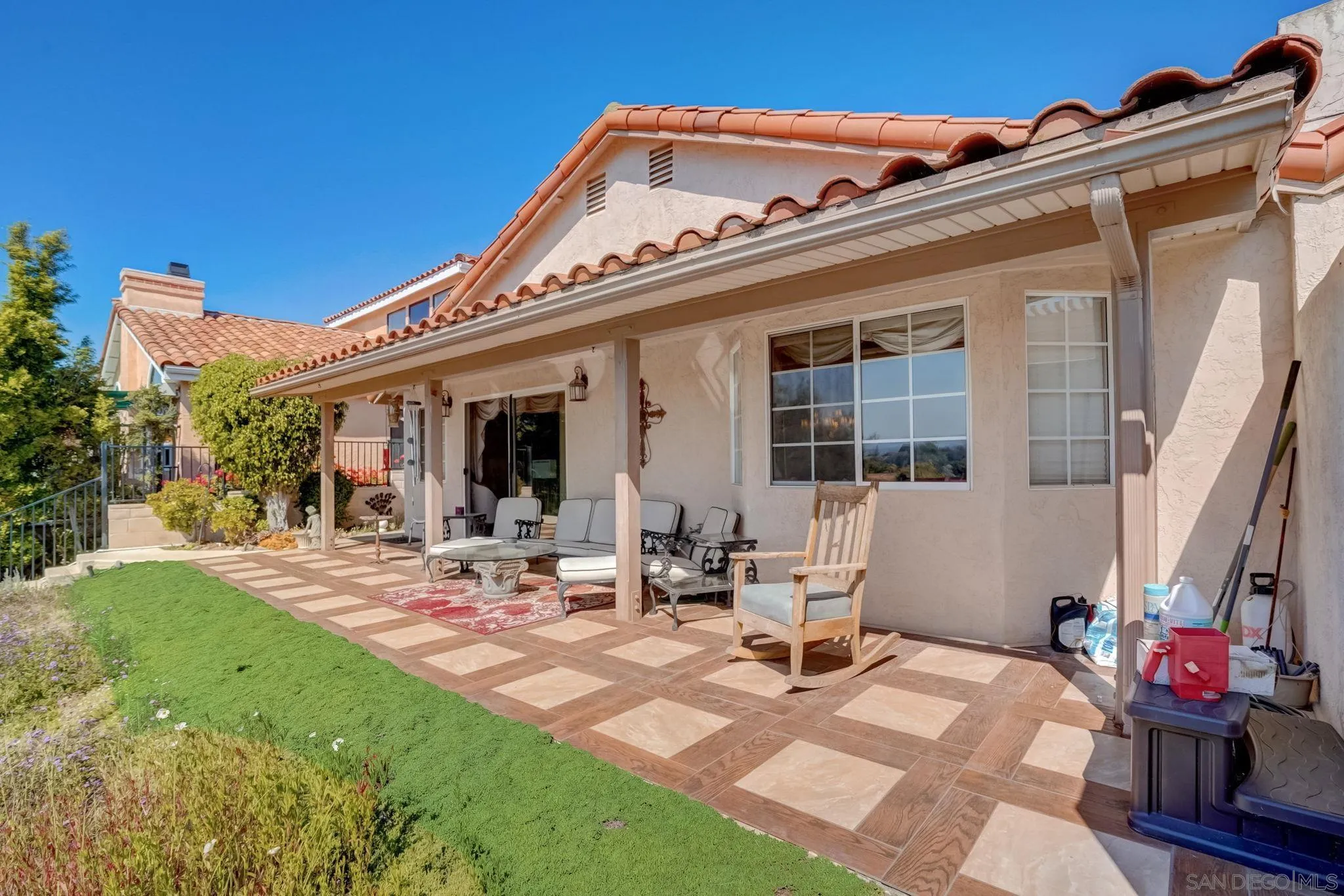 969 Ridge Heights Drive Fallbrook, CA 92028 - Photo 18 of 32 a view of a patio with couches table and chairs and potted plants