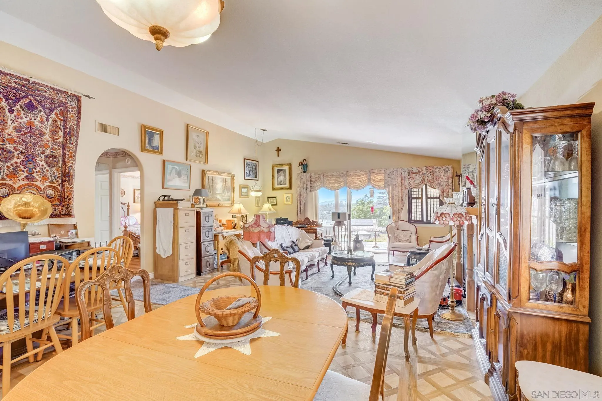 969 Ridge Heights Drive Fallbrook, CA 92028 - Photo 3 of 32 a dining room with furniture a chandelier and wooden floor