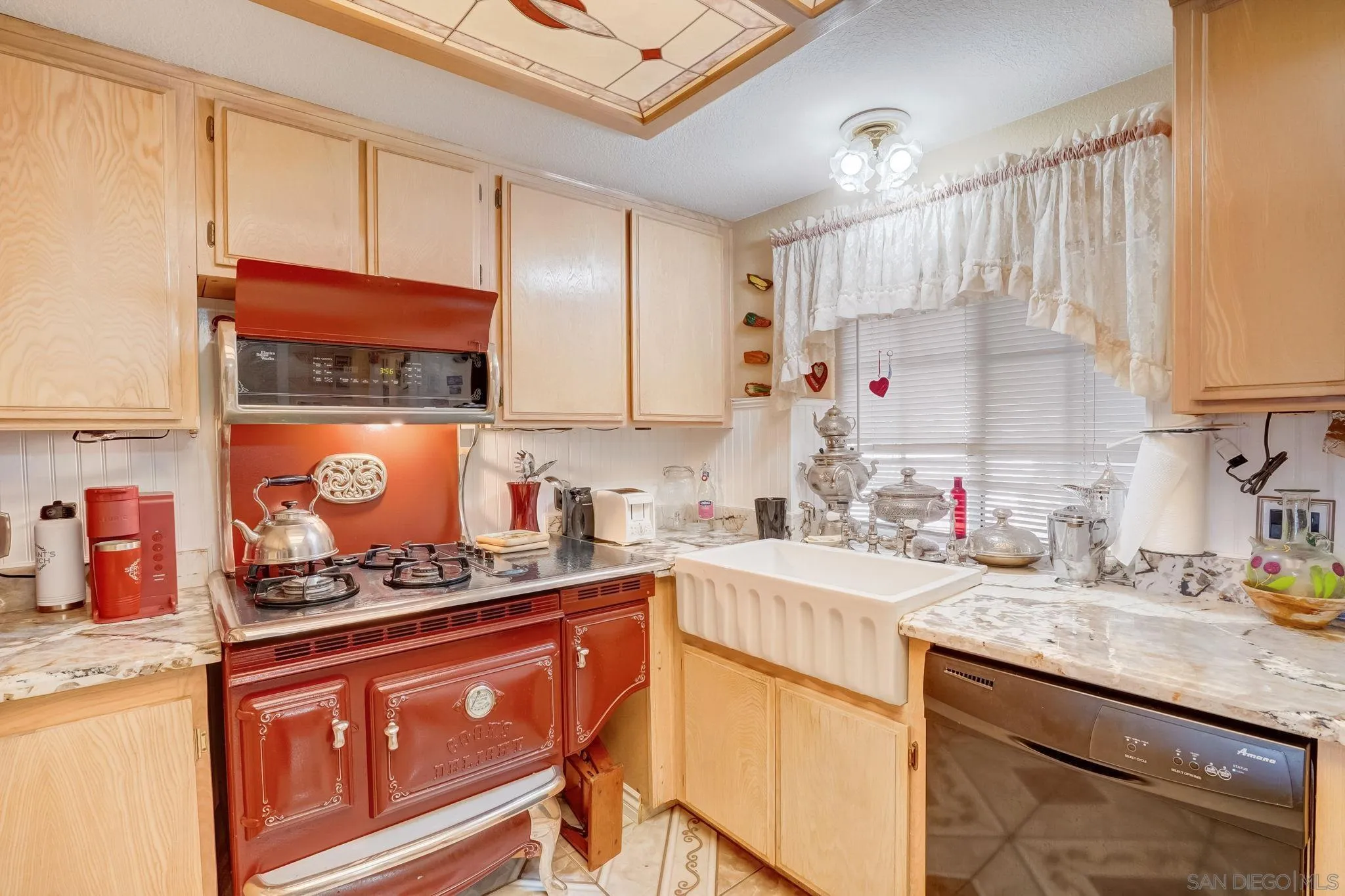 969 Ridge Heights Drive Fallbrook, CA 92028 - Photo 4 of 32 a kitchen with stainless steel appliances granite countertop a sink stove and cabinets