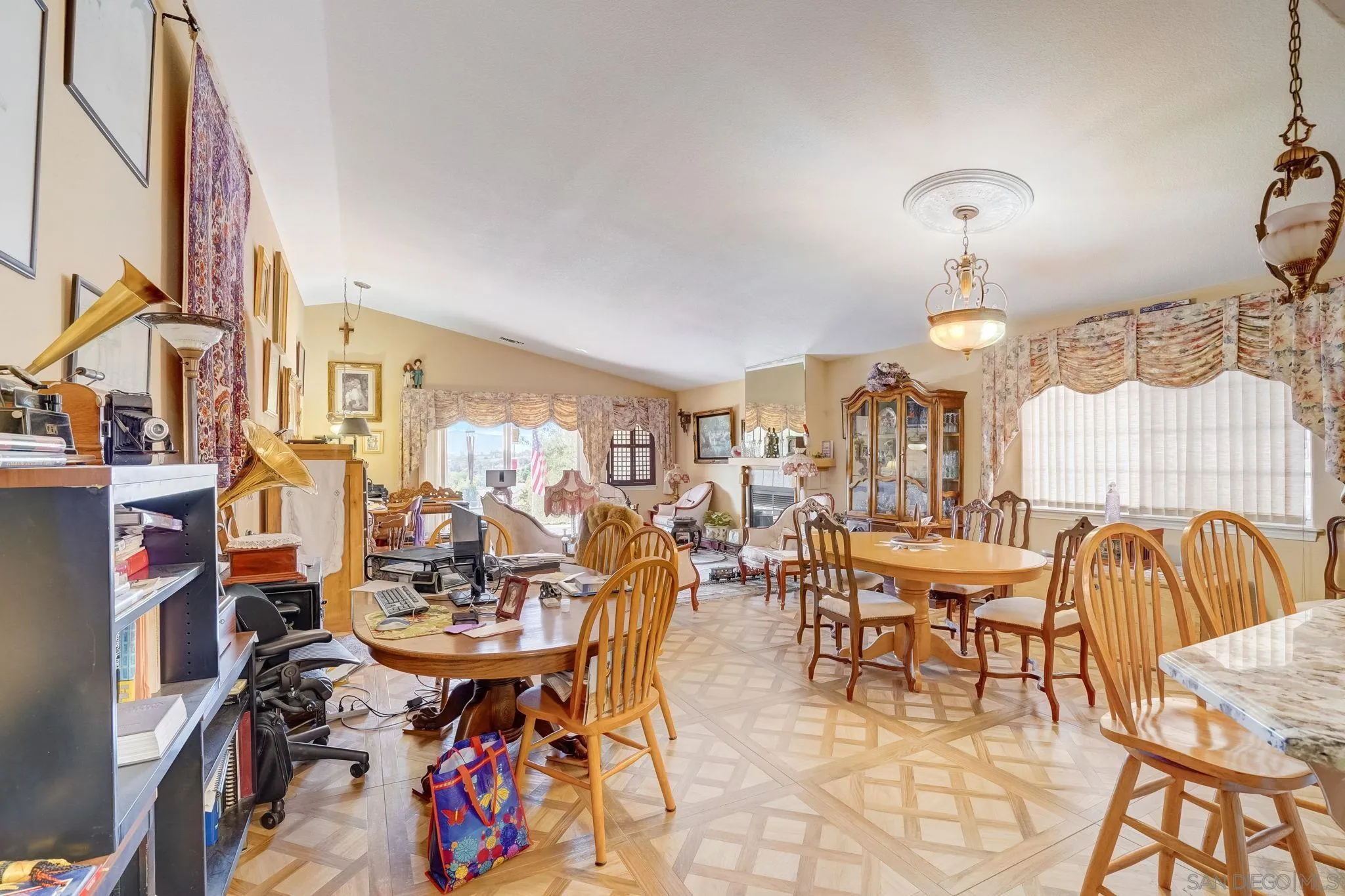 969 Ridge Heights Drive Fallbrook, CA 92028 - Photo 8 of 32 a view of a dining room with furniture and chandelier
