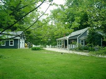 83 West Main Road Peru, MA 01235 - Photo 1 of 2 a backyard of a house with yard and tree