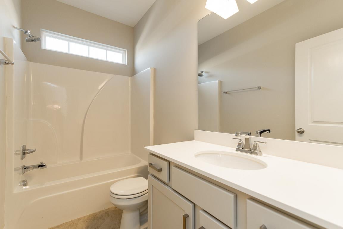 411 Butler Road Mount Juliet, TN 37122 - Photo 29 of 30 a bathroom with a sink a toilet and shower
