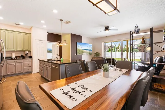 a large kitchen with kitchen island a large island in it