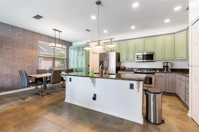 a kitchen with counter space cabinets and appliances