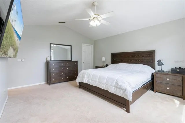a bedroom with a bed and a dresser