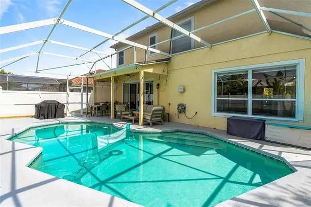 a view of a backyard with a patio and a patio
