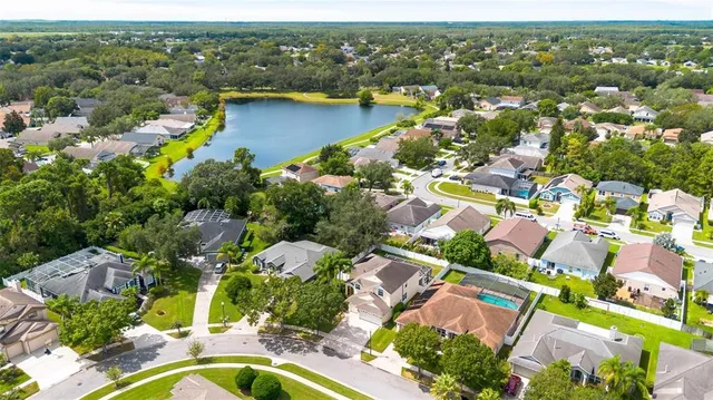 an aerial view of residential houses with outdoor space
