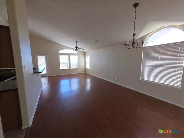 a kitchen with stainless steel appliances a stove and a sink