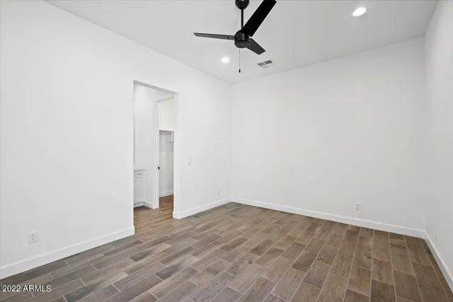 a view of a room with wooden floor