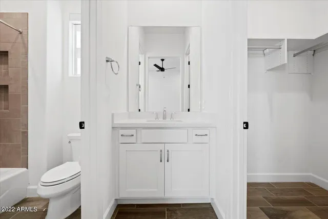 a bathroom with a sink and toilet