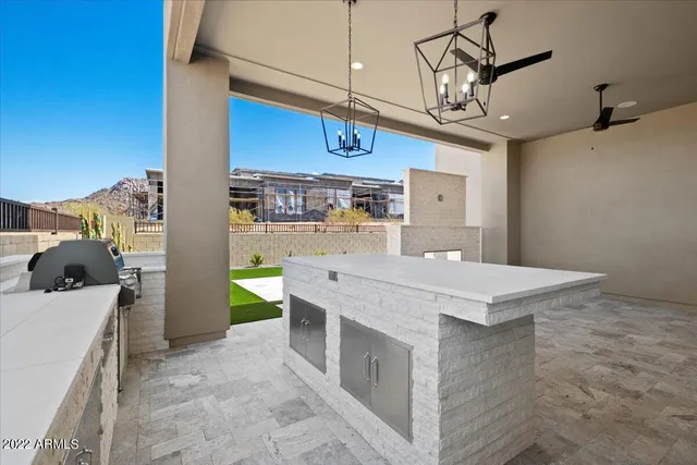 a kitchen that has a lot of cabinets in it