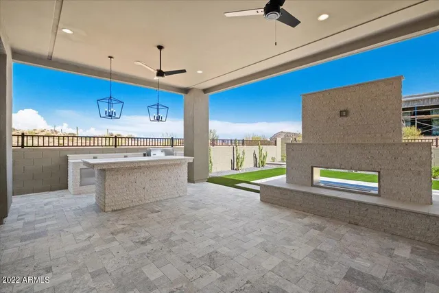 a kitchen with kitchen island a sink stainless steel appliances and cabinets